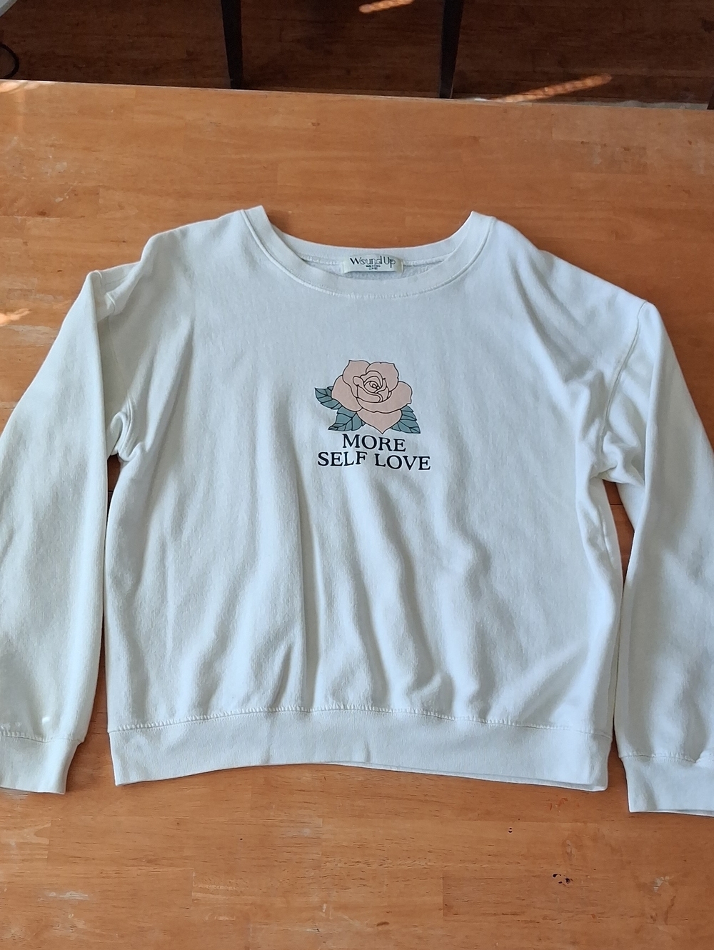 Wound Up Cream Sweatshirt with Pink Rose Graphic